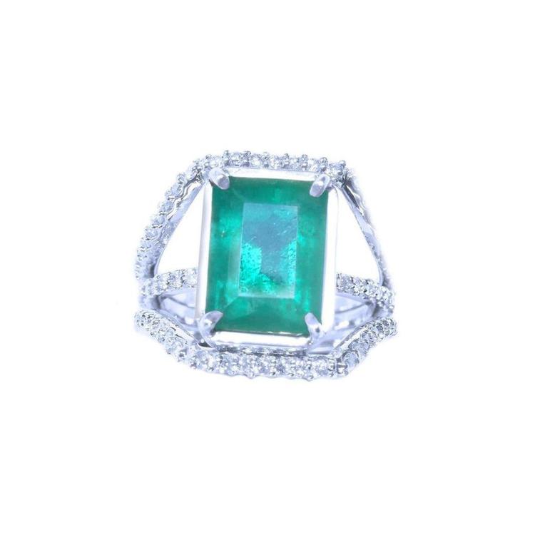 Emerald-cut natural colombian emerald ring for women with three rows of natural diamonds crafted in 14k white gold.