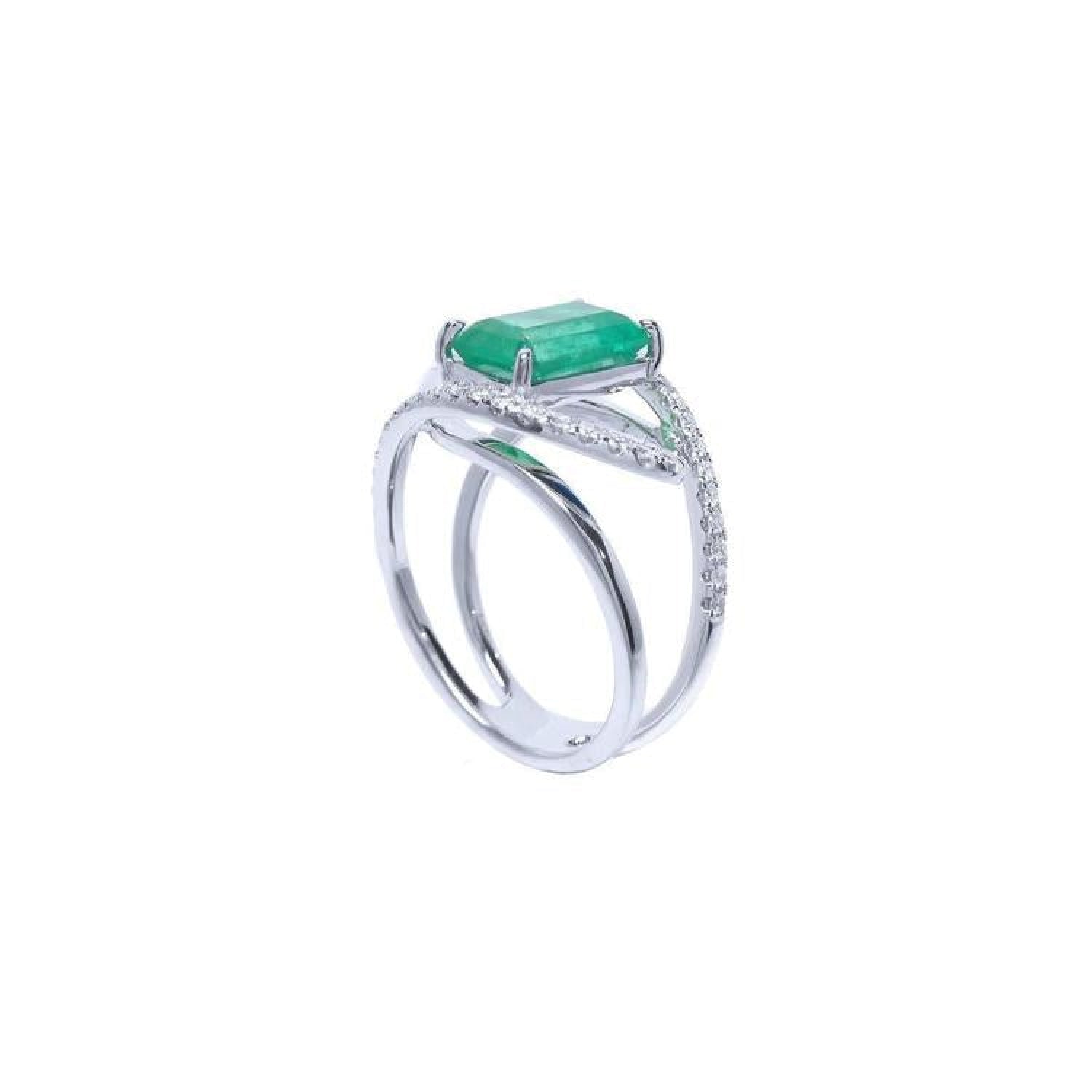 14K white gold ring with rectangular emerald-cut emerald and diamond split shank.