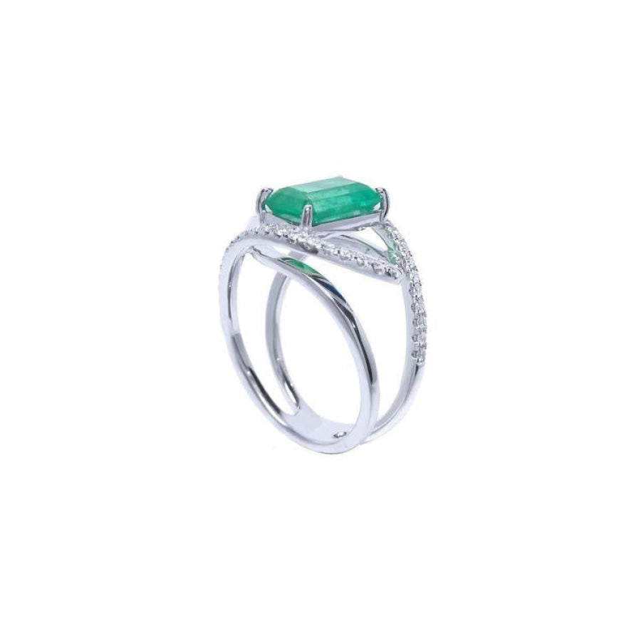 14K white gold ring with rectangular emerald-cut emerald and diamond split shank.
