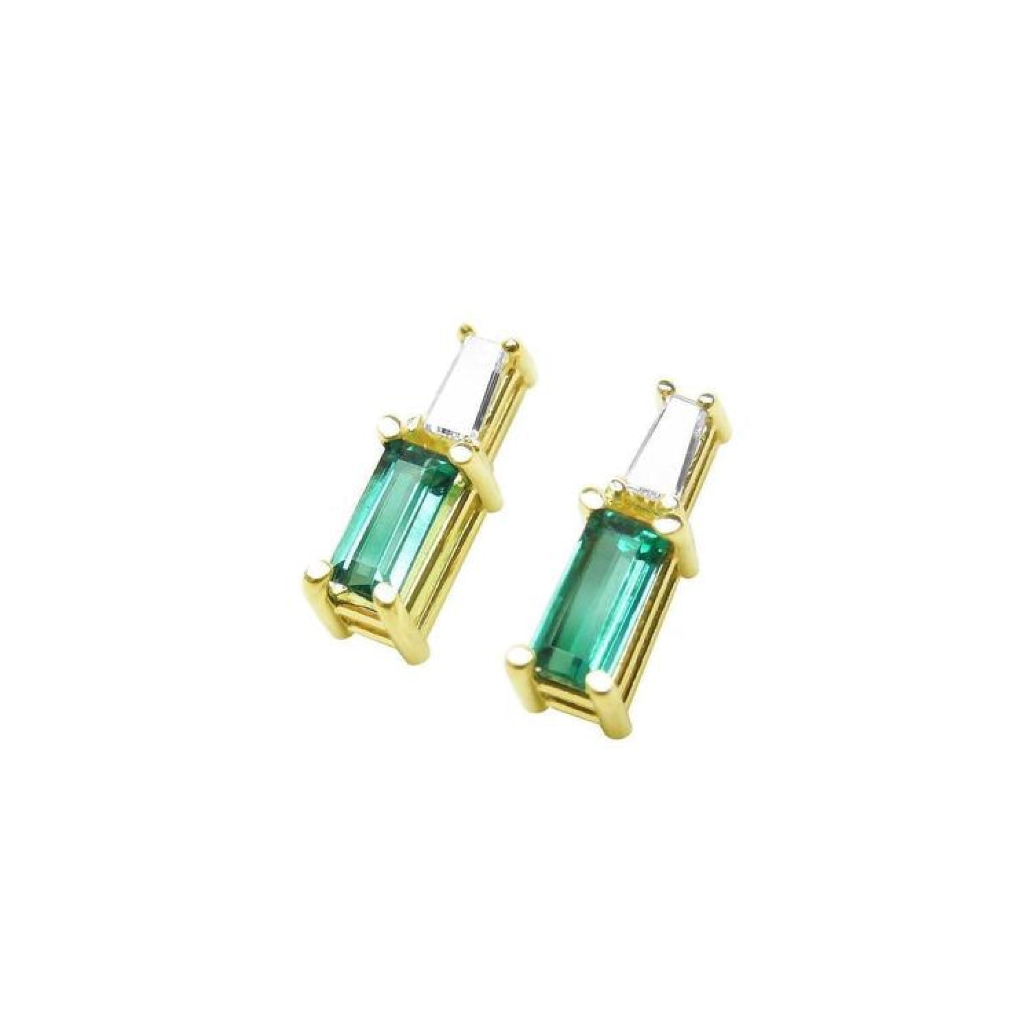 Minimalist 14K gold stud earrings with baguette emeralds and tapered diamond accents.