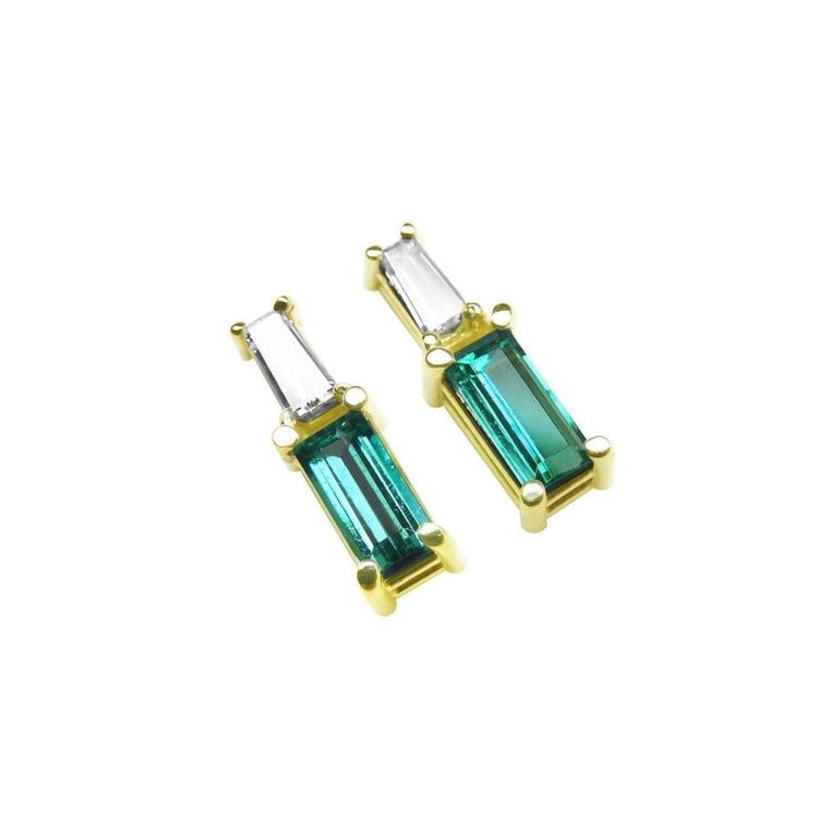 Pair of minimalist baguette cut emerald and diamond stud earrings, made of 14k yellow gold.