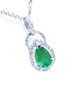 14k white gold natural colombian emerald and diamond pendant pear shaped.