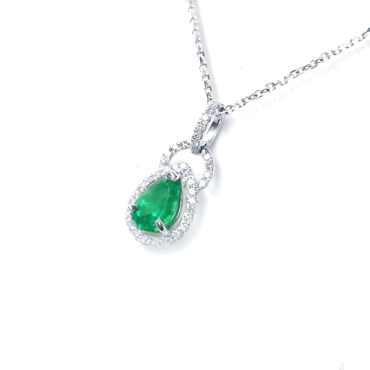 Natural emerald teardrop pendant with diamond accents in 14k white gold.