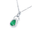 Natural emerald teardrop pendant with diamond accents in 14k white gold.