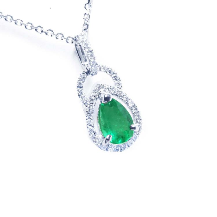 14k white gold natural colombian emerald and diamond pendant pear shaped.