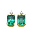 A pair of Colombian emerald stud earrings, front position top side view.