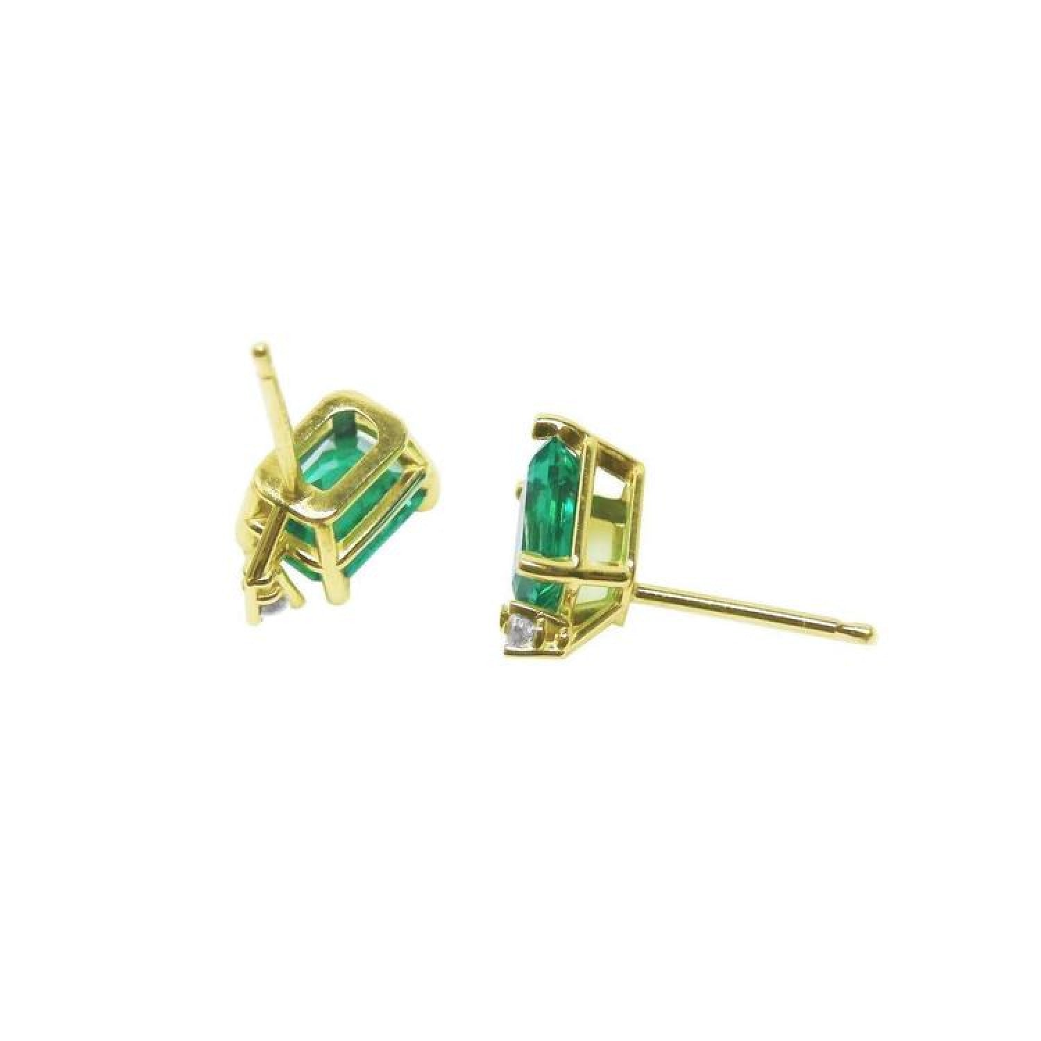 14K yellow gold stud earrings with rectangular Colombian emeralds and accent diamonds.