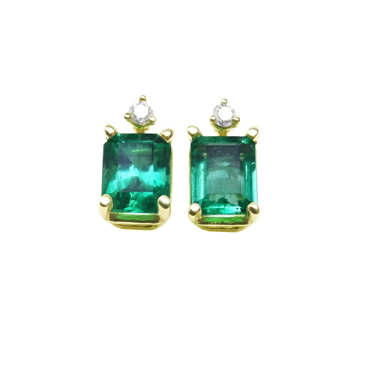A pair of natural Colombian emerald stud earrings in 14k yellow gold.