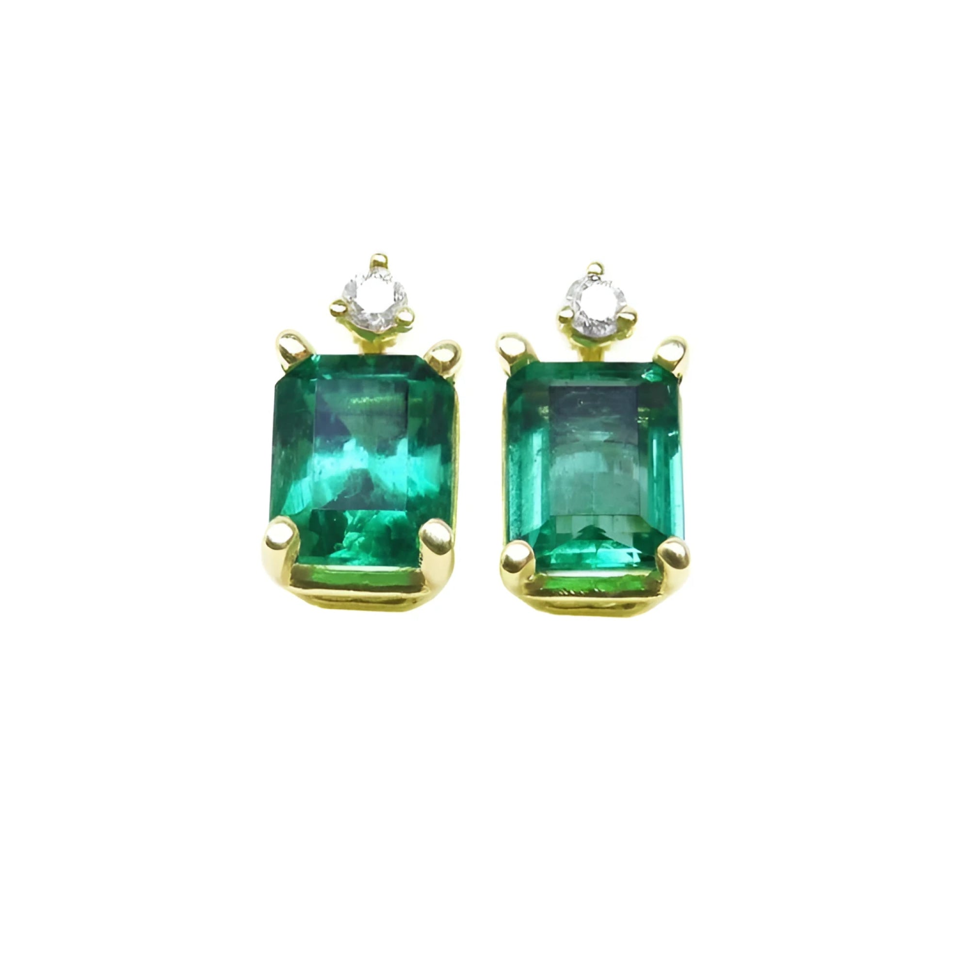 A pair of natural Colombian emerald stud earrings in 14k yellow gold.
