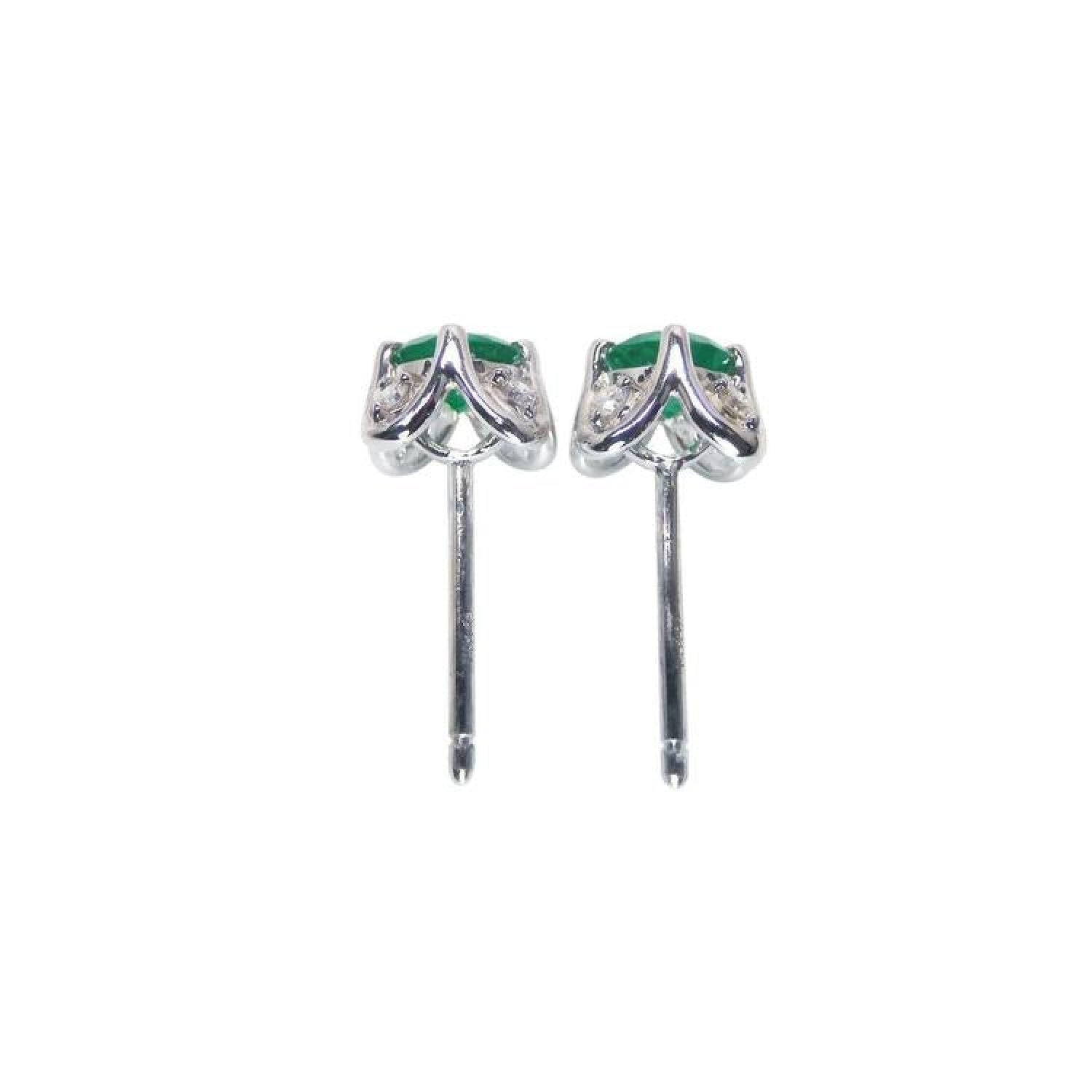 Emerald and diamond tulip stud earrings in 14K white gold with deep bluish-green gems.