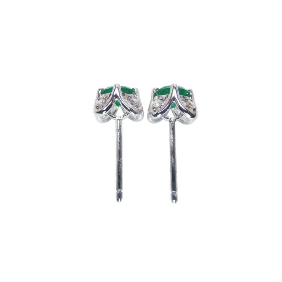 Emerald and diamond tulip stud earrings in 14K white gold with deep bluish-green gems.