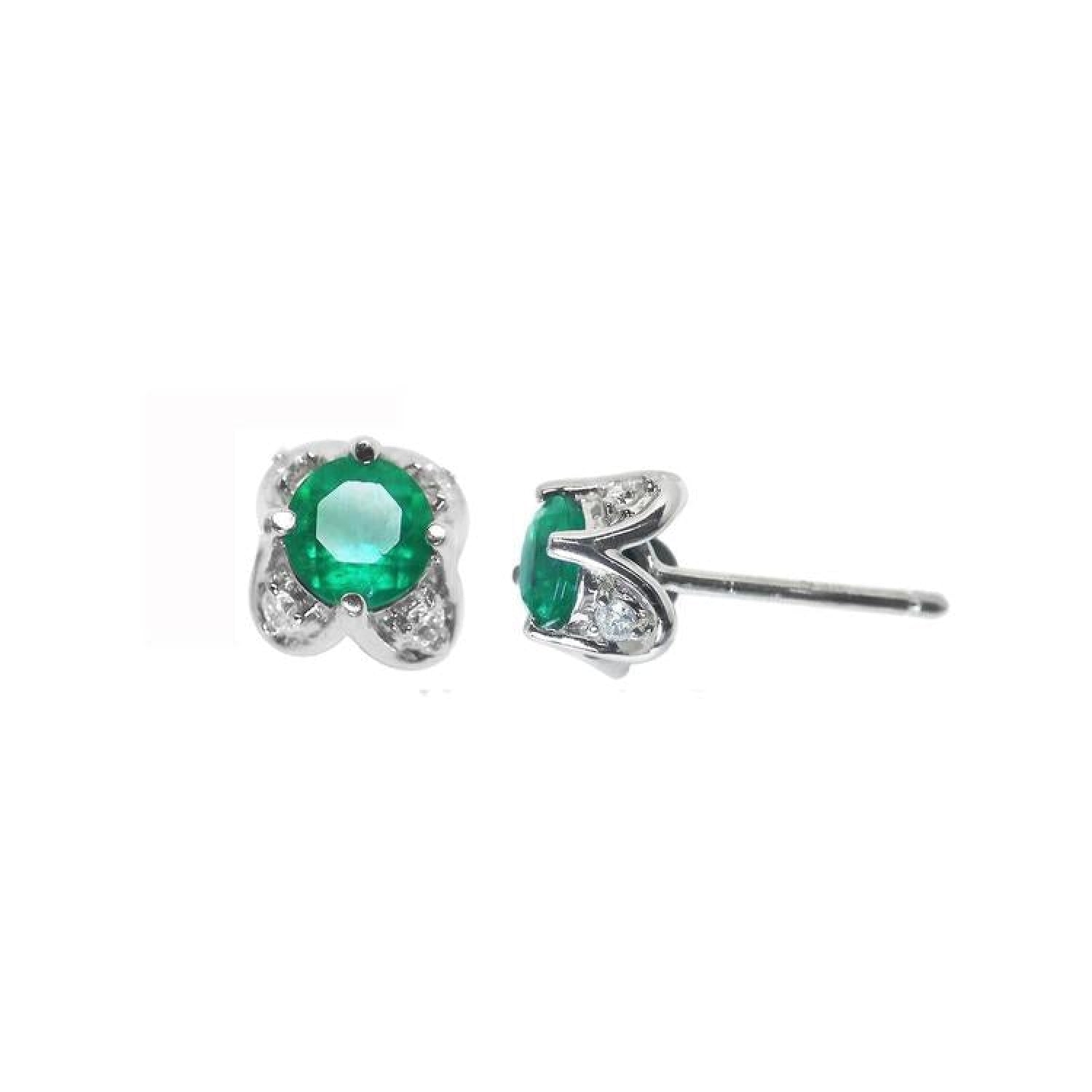 Emerald and diamond tulip stud earrings in 14K white gold with sparkling bluish-green stones.