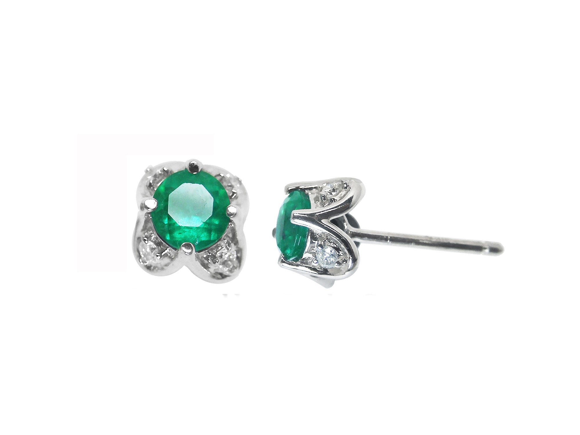 Pair of emerald and diamond tulip stud earrings on a front and underside view position.