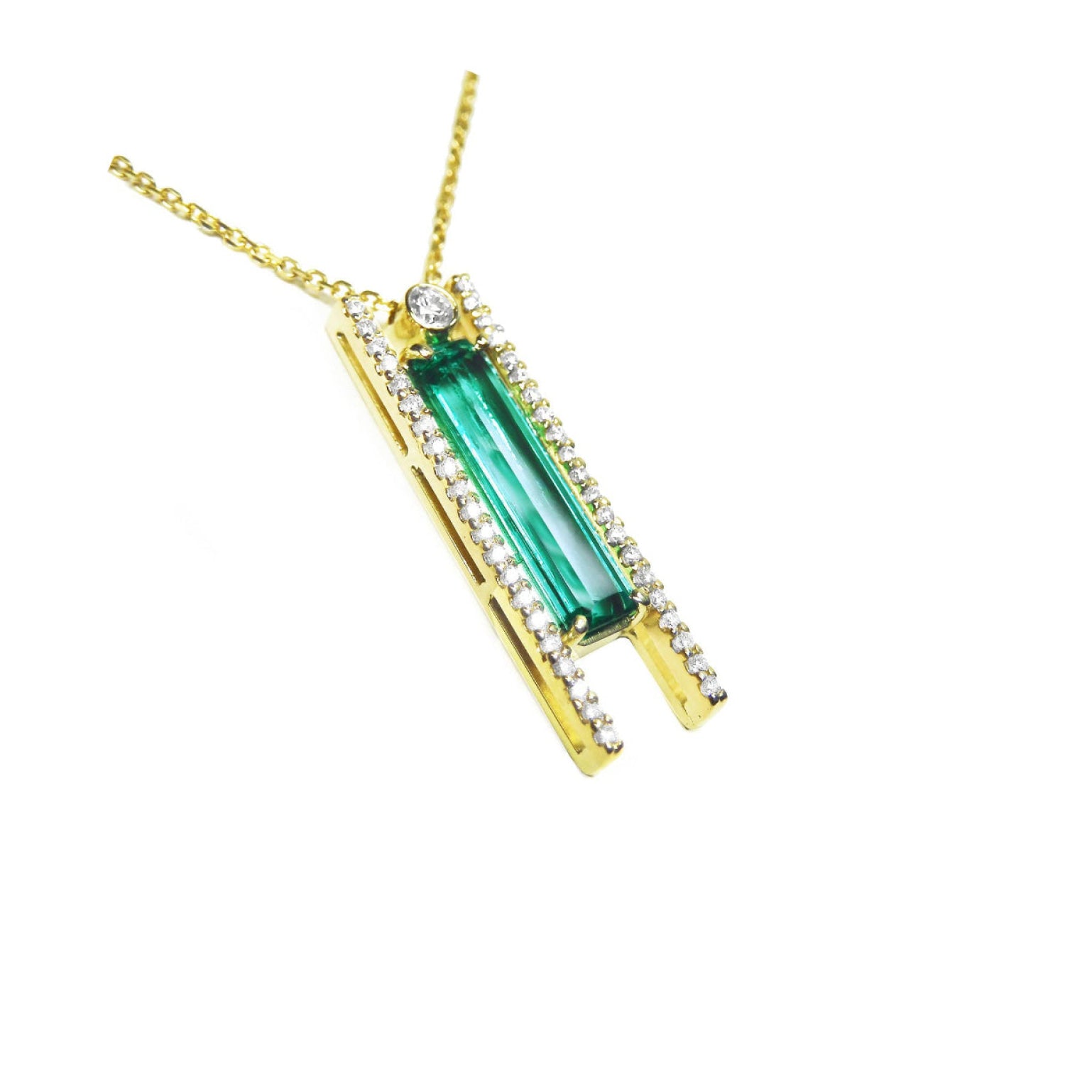 Yellow gold necklace with a natural baguette cut emerald gemstone pendant side natural diamonds.