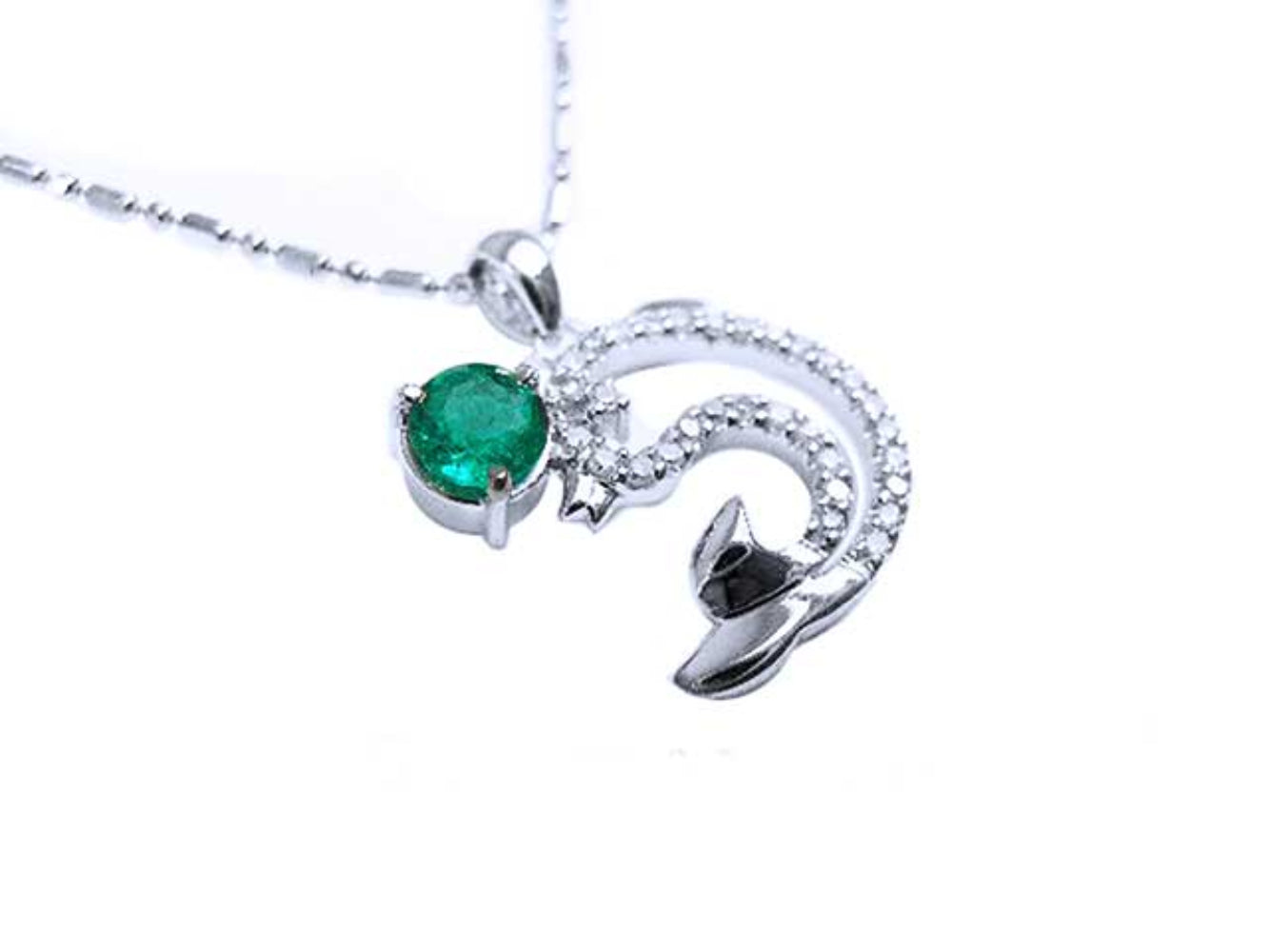 Emerald dolphin pendant with a round cut natural emerald and diamonds in white gold.