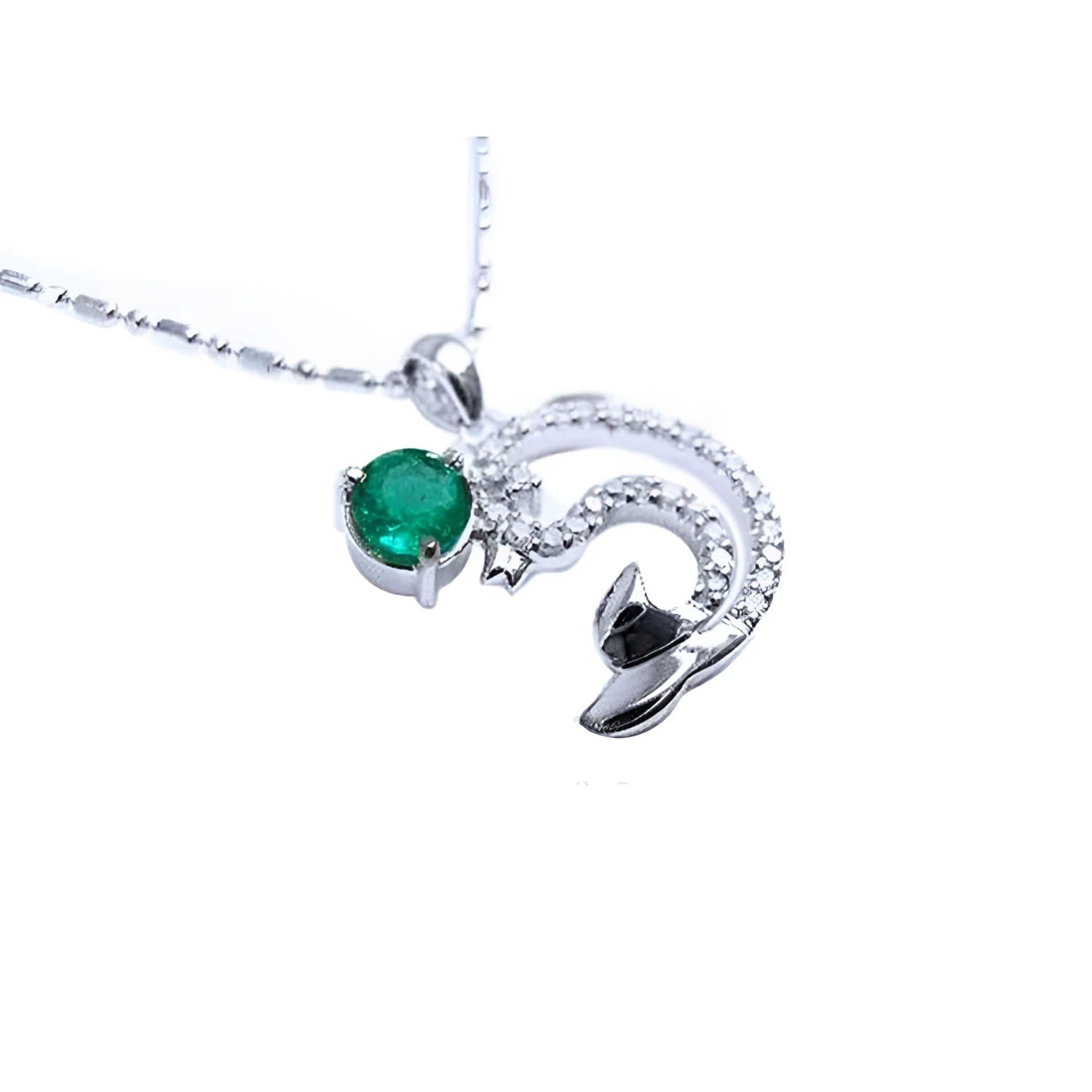 Emerald dolphin pendant with a round cut natural emerald and diamonds in white gold.