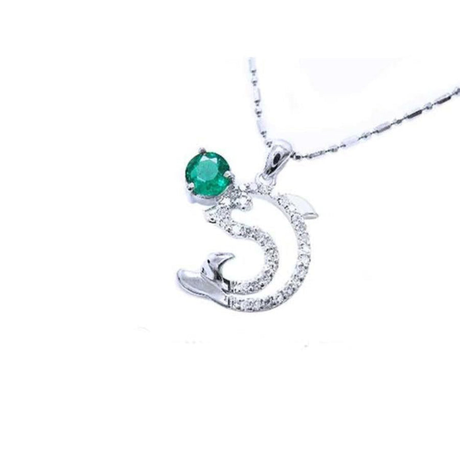 14K white gold dolphin pendant with a round deep green emerald and sparkling accents.