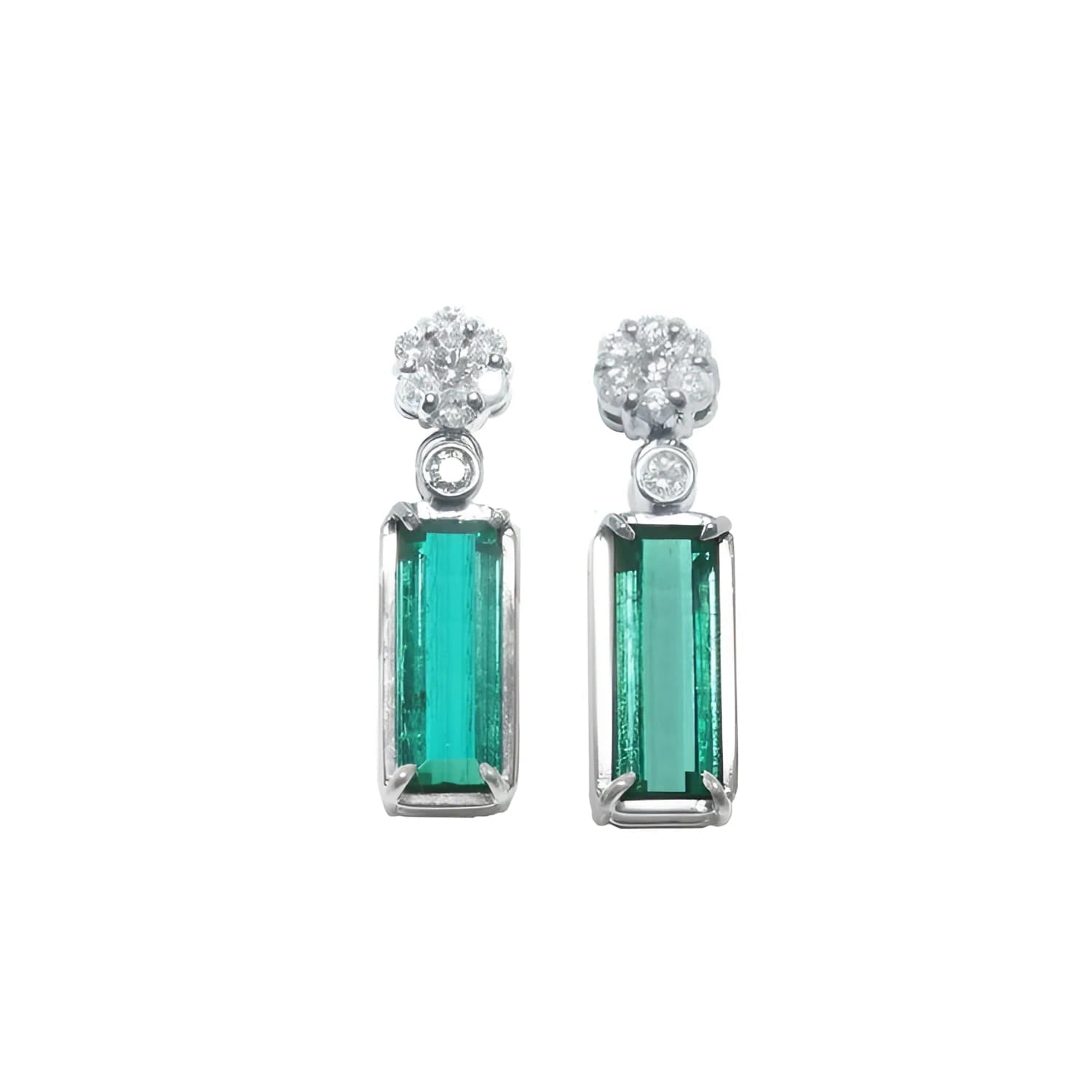 14K white gold dangling earrings with rectangular emeralds and diamond clusters.