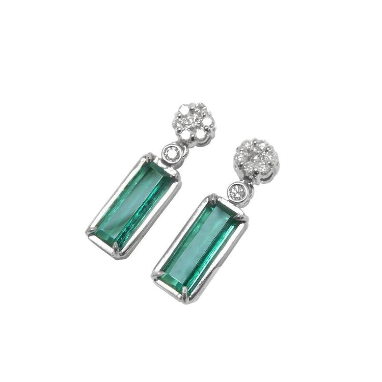 14K white gold dangling earrings with rectangular emeralds and diamond flower clusters.