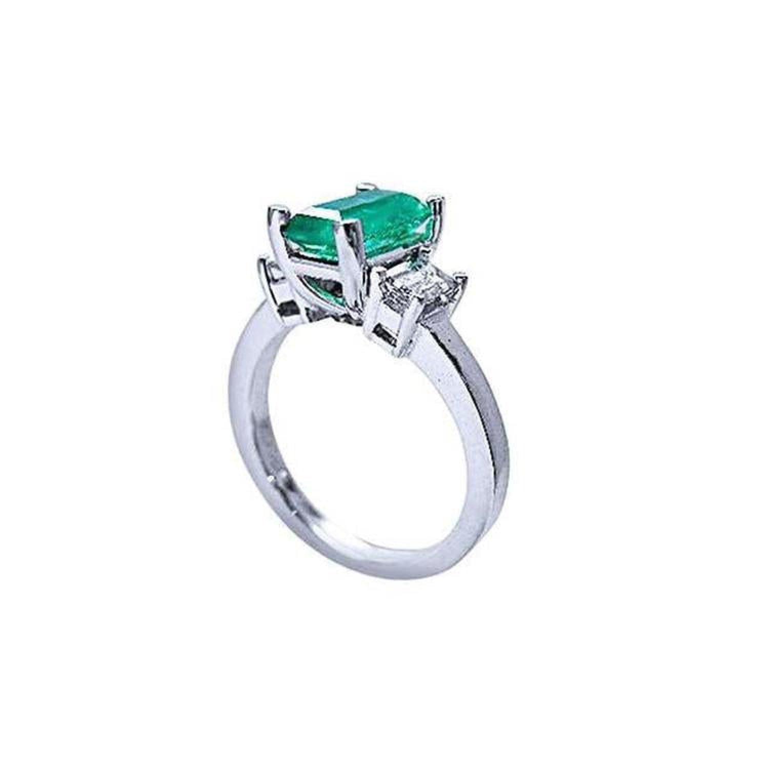 1.09 ct emerald cut Colombian emerald engagement ring with baguette diamonds in 18K white gold.