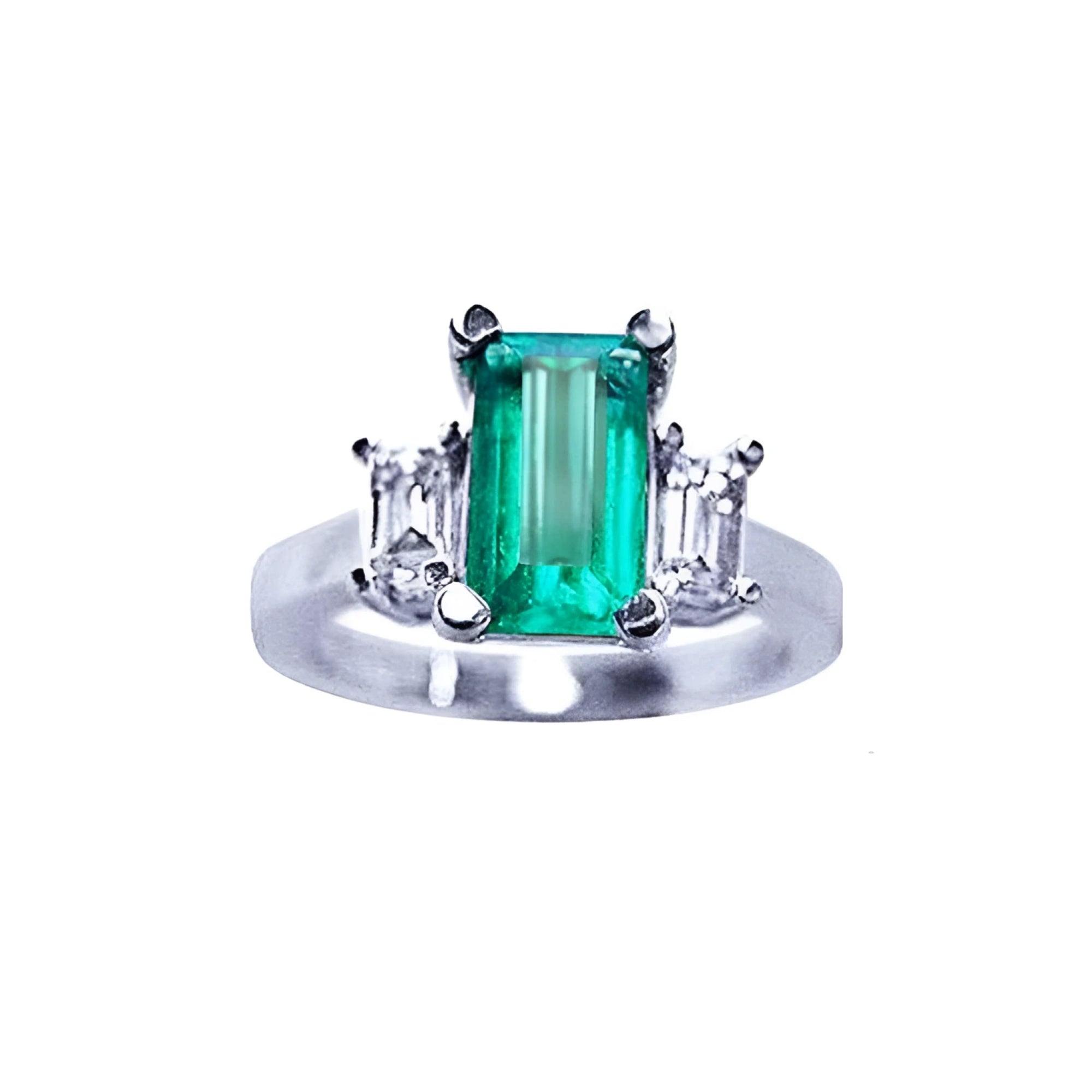 A colombian emerald three stone engagement ring side baguette diamonds made of 18k white gold.