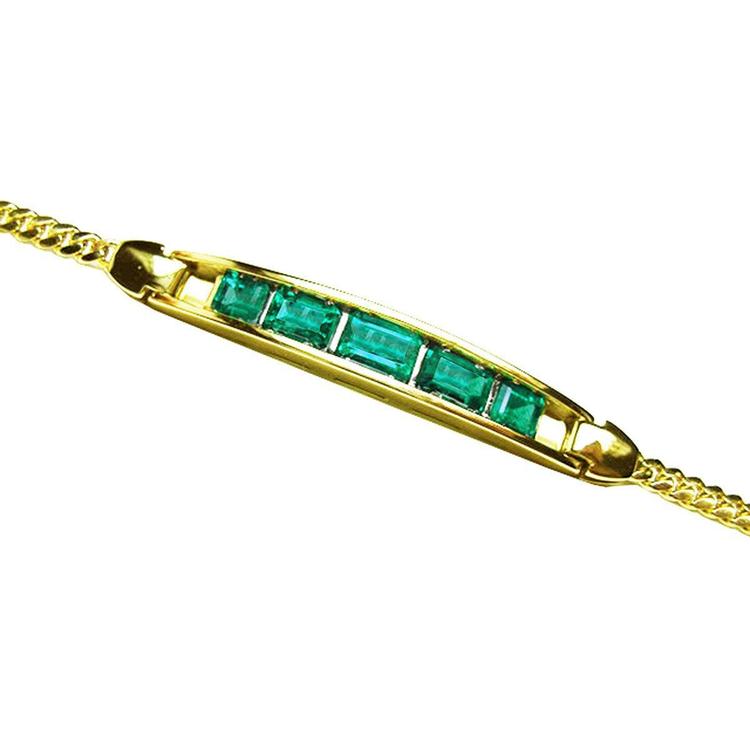 Gold bracelet with five natural colombian emeralds high quality crafted in 14l yellow gold.