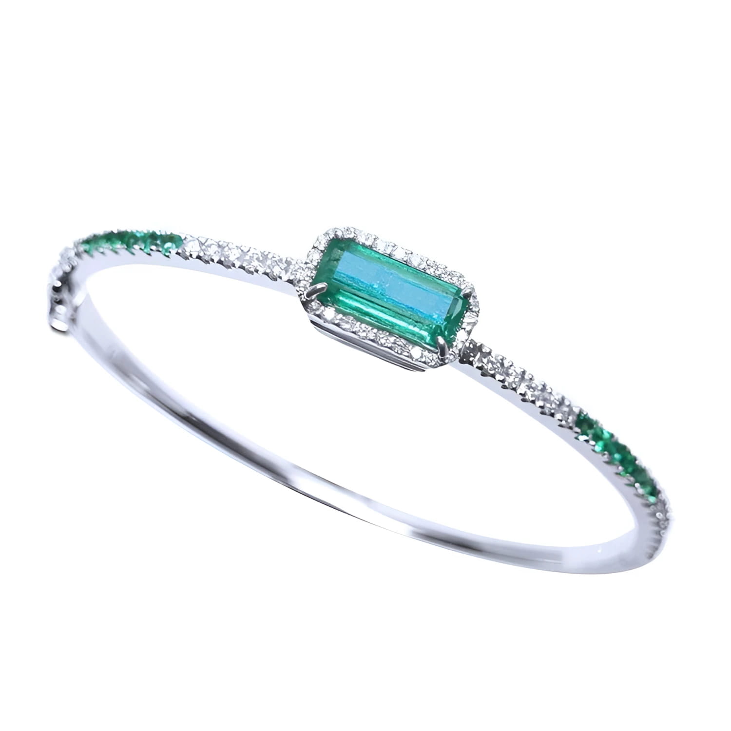 Emerald-cut Colombian emerald bangle bracelet in 14K white gold with natural diamonds.
