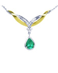 14K white/yellow gold necklace with a pear-shaped Colombian emerald and diamond chevron design.