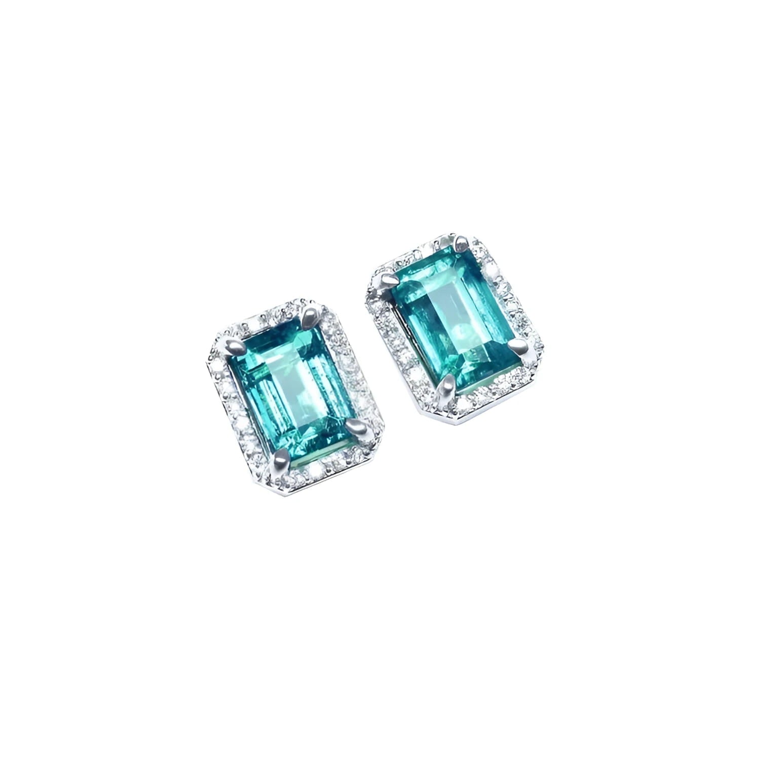 Emerald-cut natural Colombian emerald stud earrings with a halo of diamonds in 14K white gold.