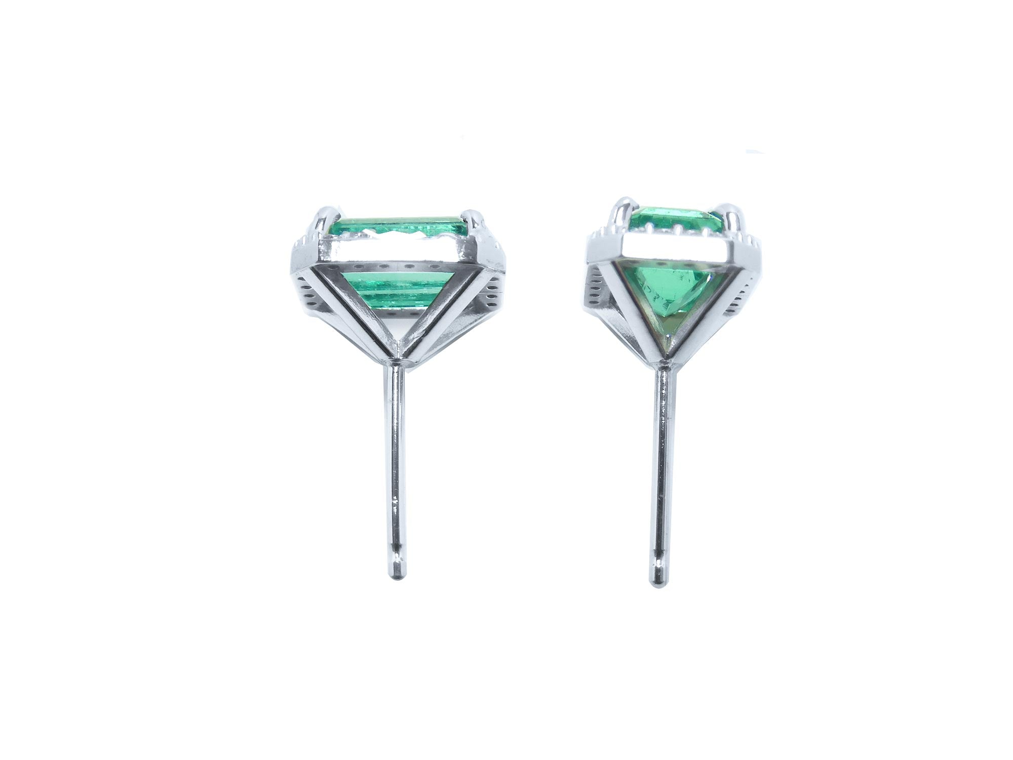 Pair of 14k white gold earrings with natural colombian emeralds, underside view push bacs.