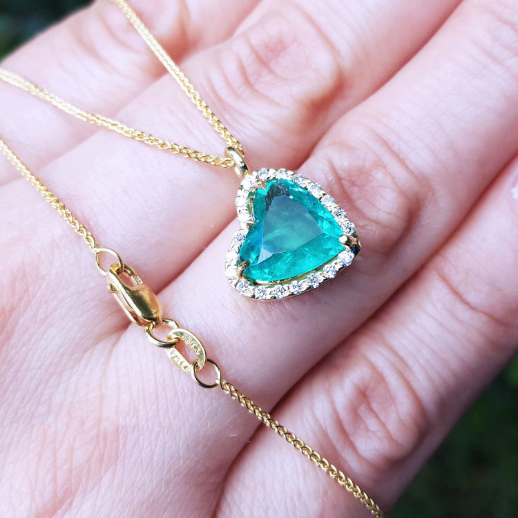 Sider Colombian emerald necklaces for sale in usa tilted heart shaped halo natural diamond handcrafted in 18k yellow