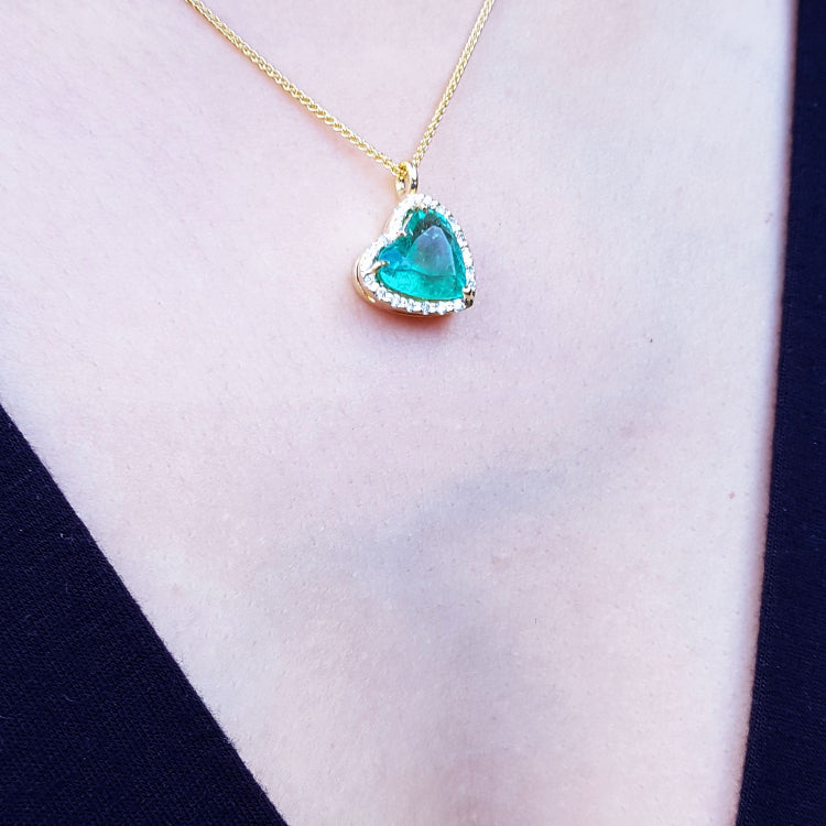 Natural emerald necklaces for sale in USA tilted heart shaped halo natural diamond handcrafted in 18k yellow
