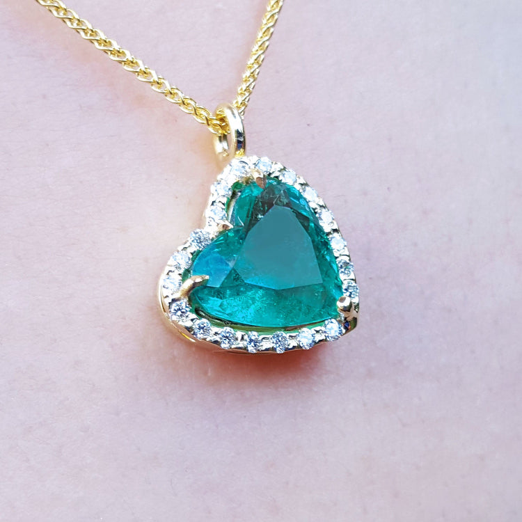 Colombian emerald necklaces for women in USA tilted heart shaped halo natural diamond handcrafted in 18k yellow