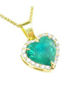 18k yellow gold necklace with a heart-shaped emerald pendant with a halo diamond.