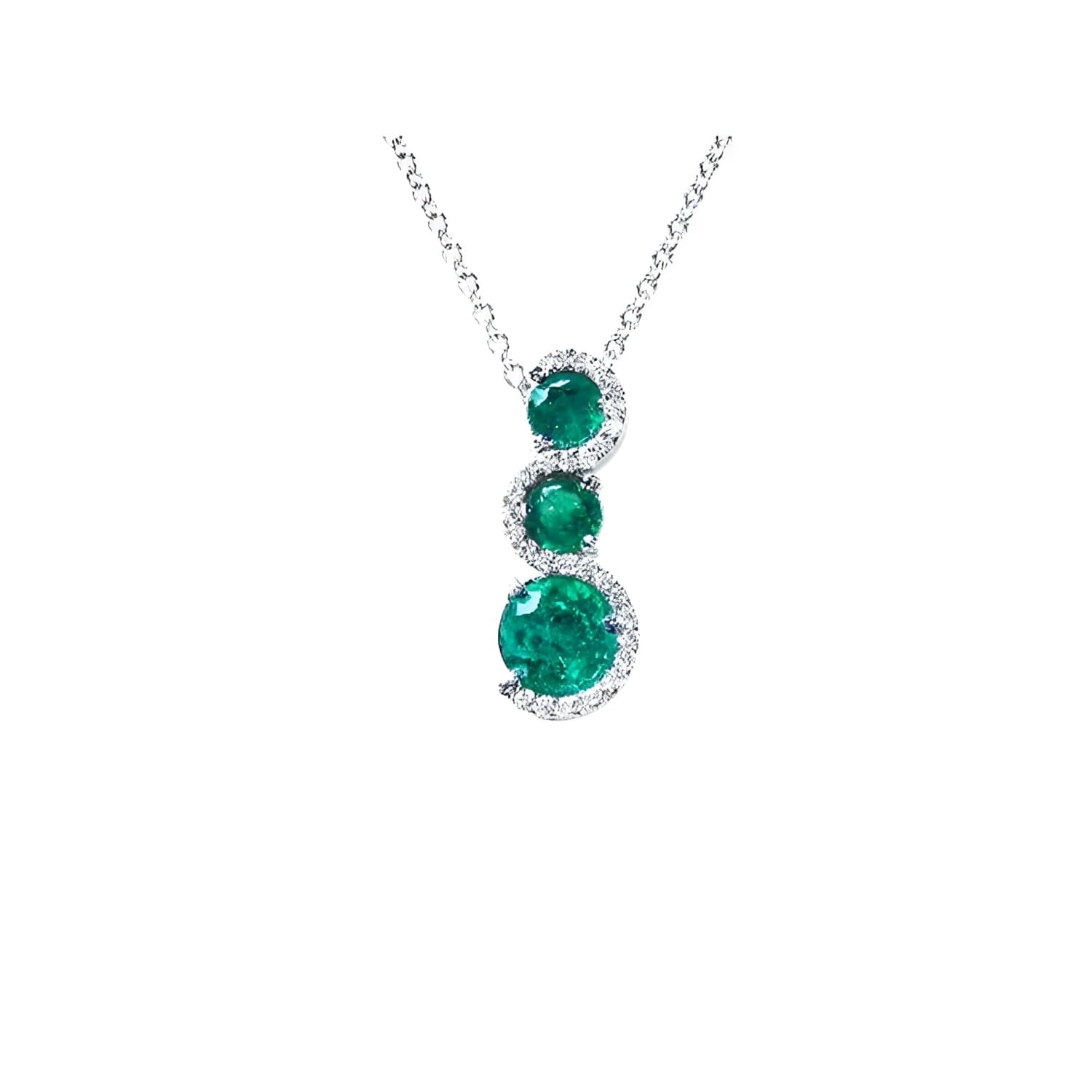 14K white gold emerald journey pendant necklace with three round, deep green emeralds encircled by diamonds.