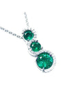 Three rounds cut natural colombian emeralds pendant journey necklace made of 14k white gold.