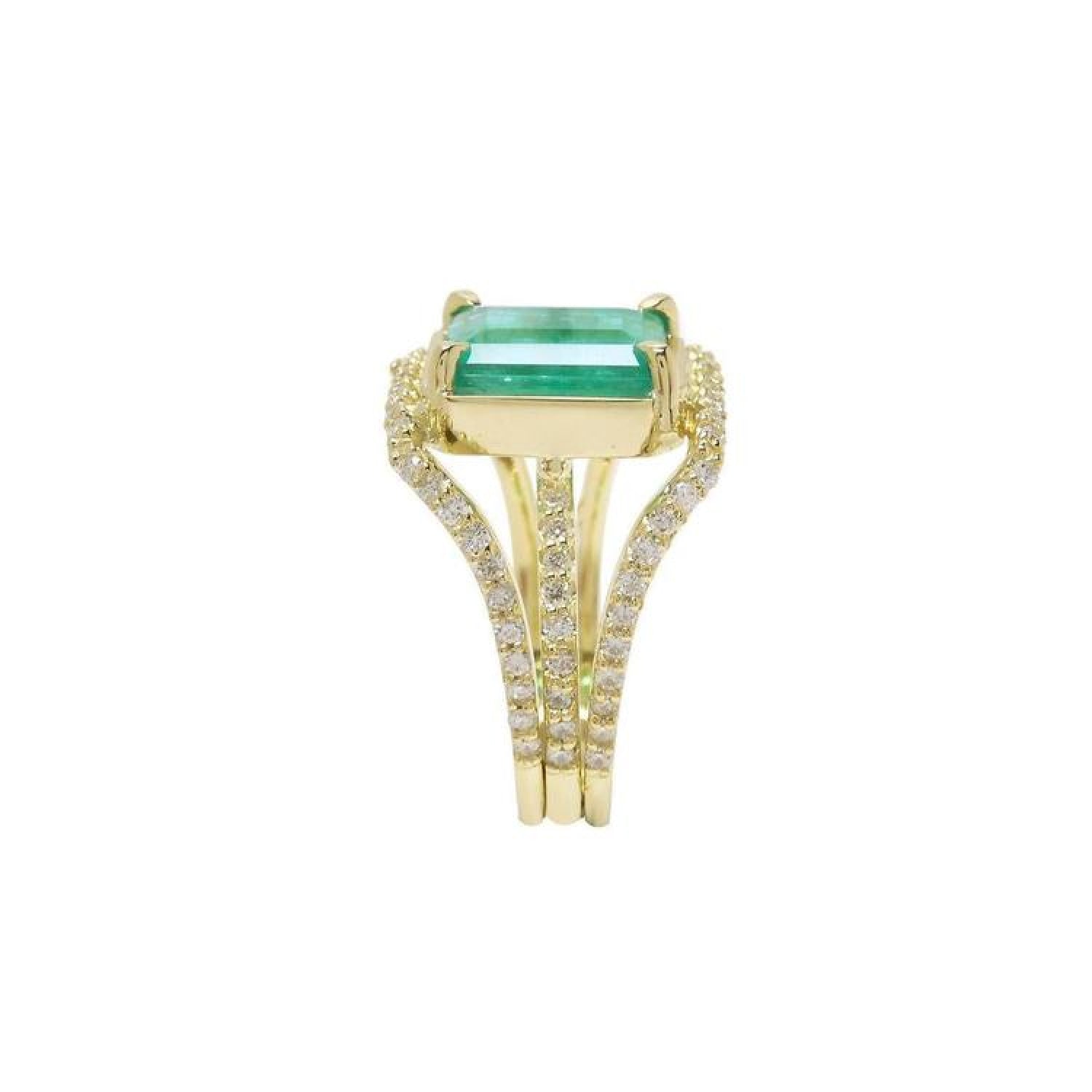 Emerald engagement ring: 2.86 ct. medium green emerald, 18K yellow gold, three rows of diamonds.