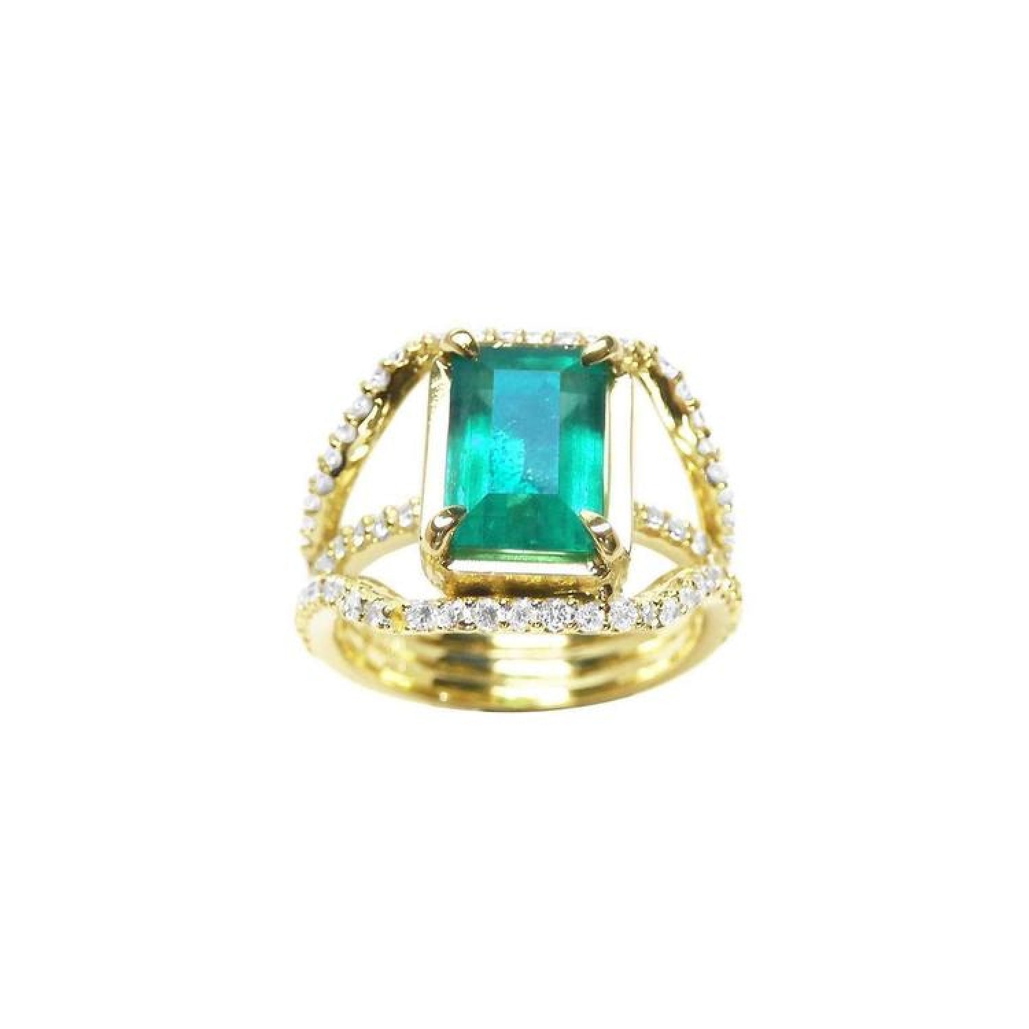 Emerald engagement ring in 18K yellow gold with a rectangular green emerald and three rows of diamonds.