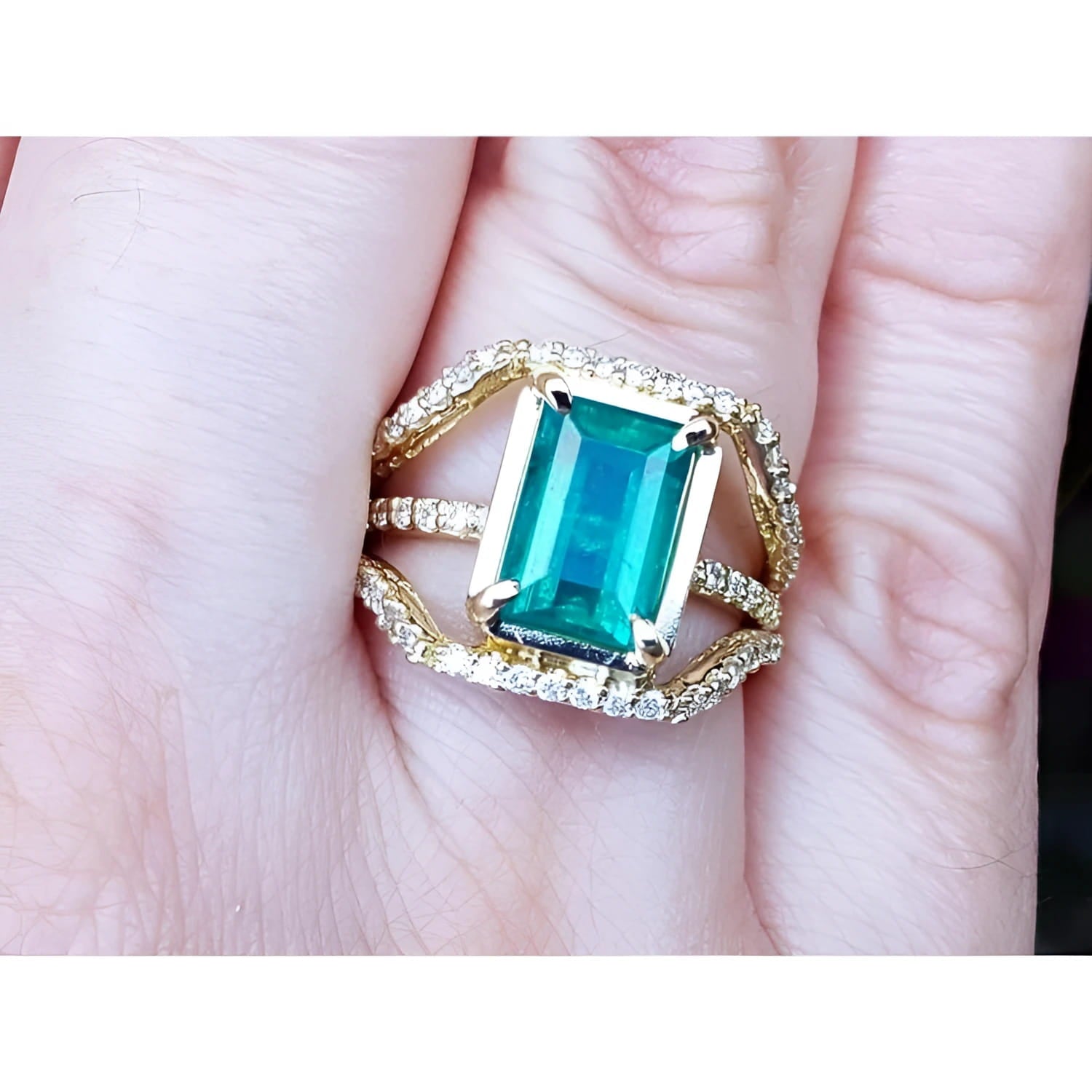 Ladies' emerald May birthstone ring with genuine diamonds in 18k yellow gold.