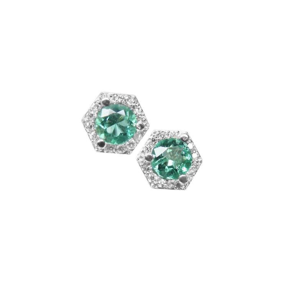 Pair of round emerald stud earrings in 14K white gold with a hexagonal diamond halo.