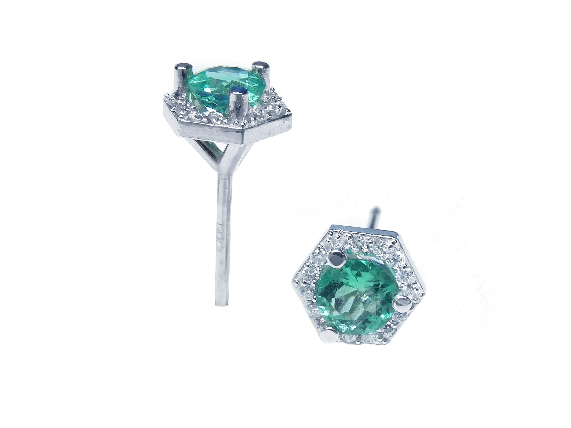 Emerald May birthstone stud earrings with hexagonal halo diamond, top and underside profile views.