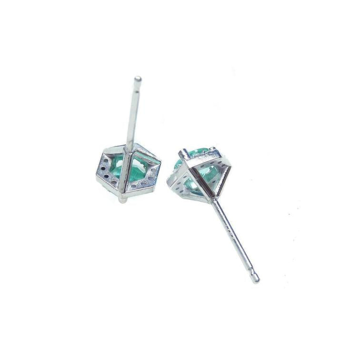 Pair of 14K white gold stud earrings with round cut emeralds in a hexagonal setting.