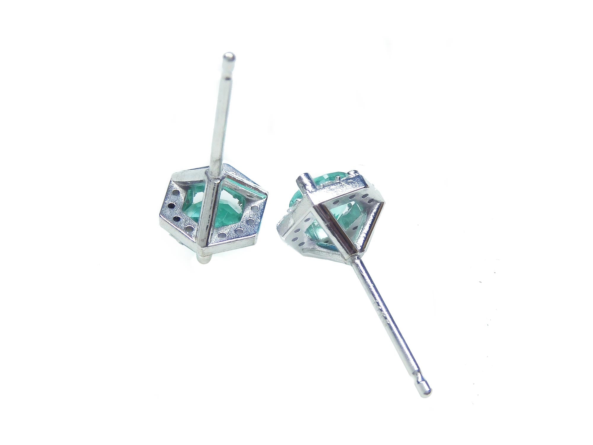 May birthstone emerald stud earrings in 14k white gold, in upside down position, underside view