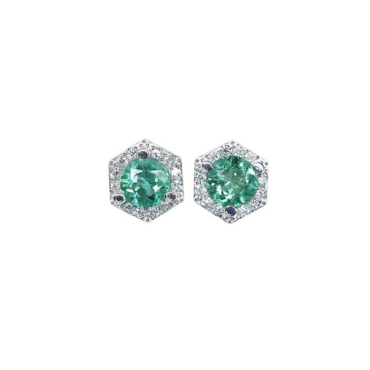 A pair of emerald stud earrings with small geometric halo diamond accents, set in 14K white gold.
