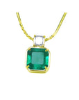 Asscher cut Colombian emerald necklace with a princess cut diamond on an 18K yellow gold chain.