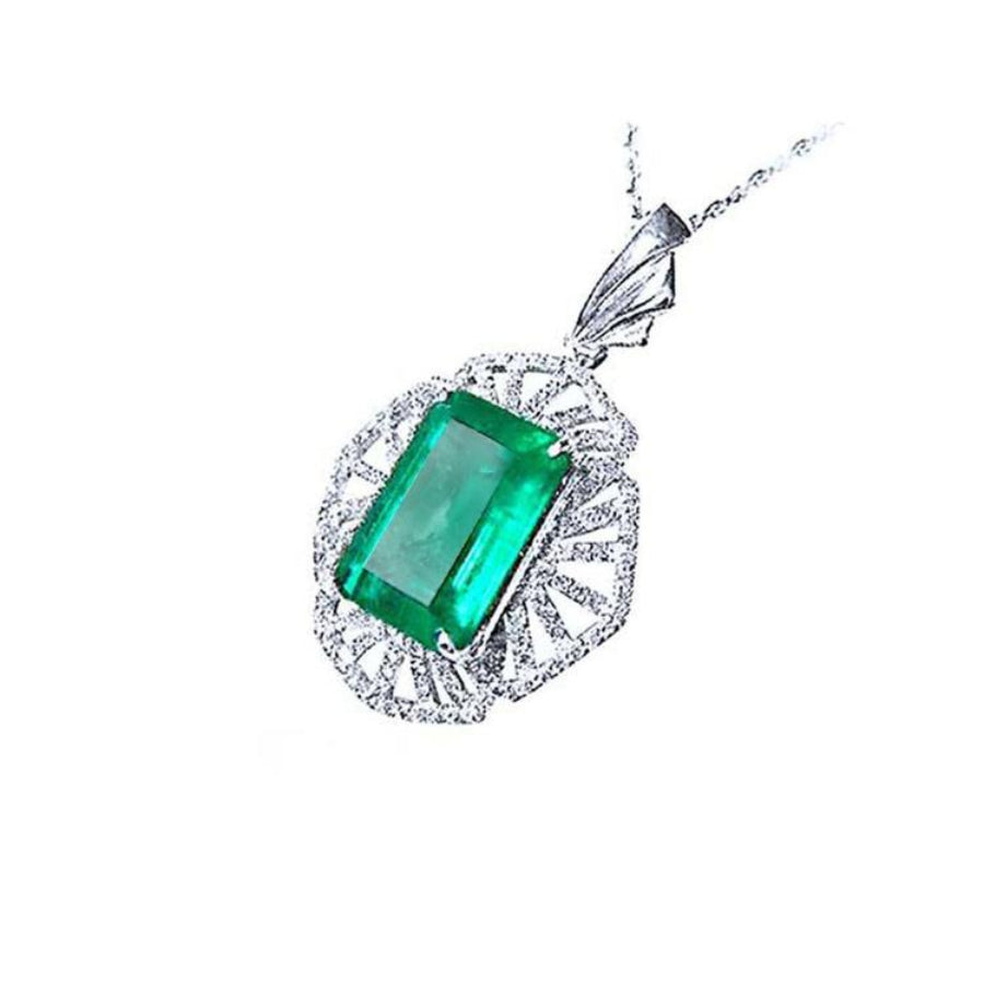 6.19 ct. emerald-cut Colombian emerald pendant with natural diamonds in 14K white gold.