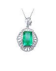 Emerald-cut emerald pendant in 14K white gold with natural diamonds, unique design.