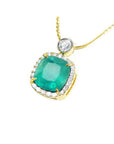 18k gold emerald cushion cut necklace natural 8.07 carats encircled in a halo of natural diamonds.