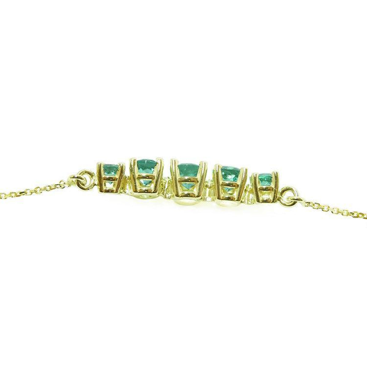 14K gold necklace with five round, medium light green Colombian emeralds, graduated in size.