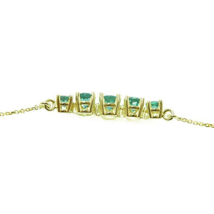 14K gold necklace with five round, medium light green Colombian emeralds, graduated in size.
